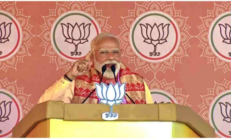 PM Modi Assam Rally, Assam Election 2026, Modi vs Congress Assam, Gogamukh Rally News, Lakhpati Didi Scheme Assam, Assam Development News